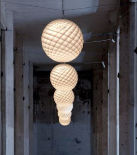 Patera – Louis Poulsen  The pendant is a glowing sphere built up of small diamond-shaped cells. Each cell is carefully designed to capture light and to shield the light source from the viewing angles above 45 degrees. 